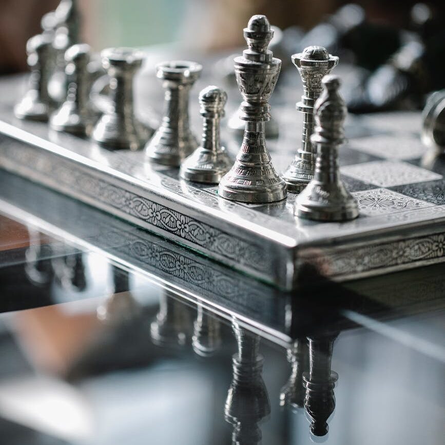 set of chess pieces on board