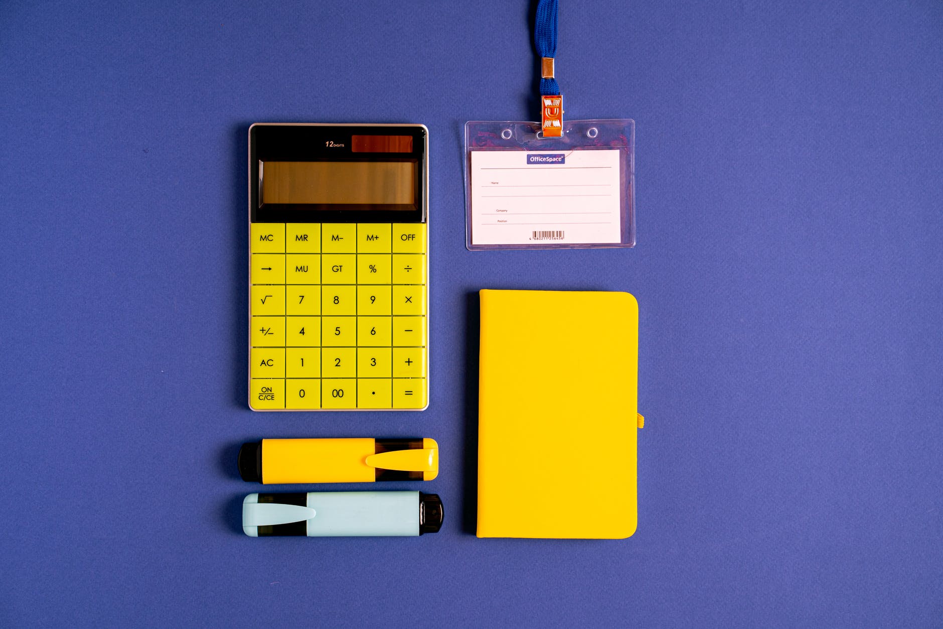 yellow and black calculator on blue background