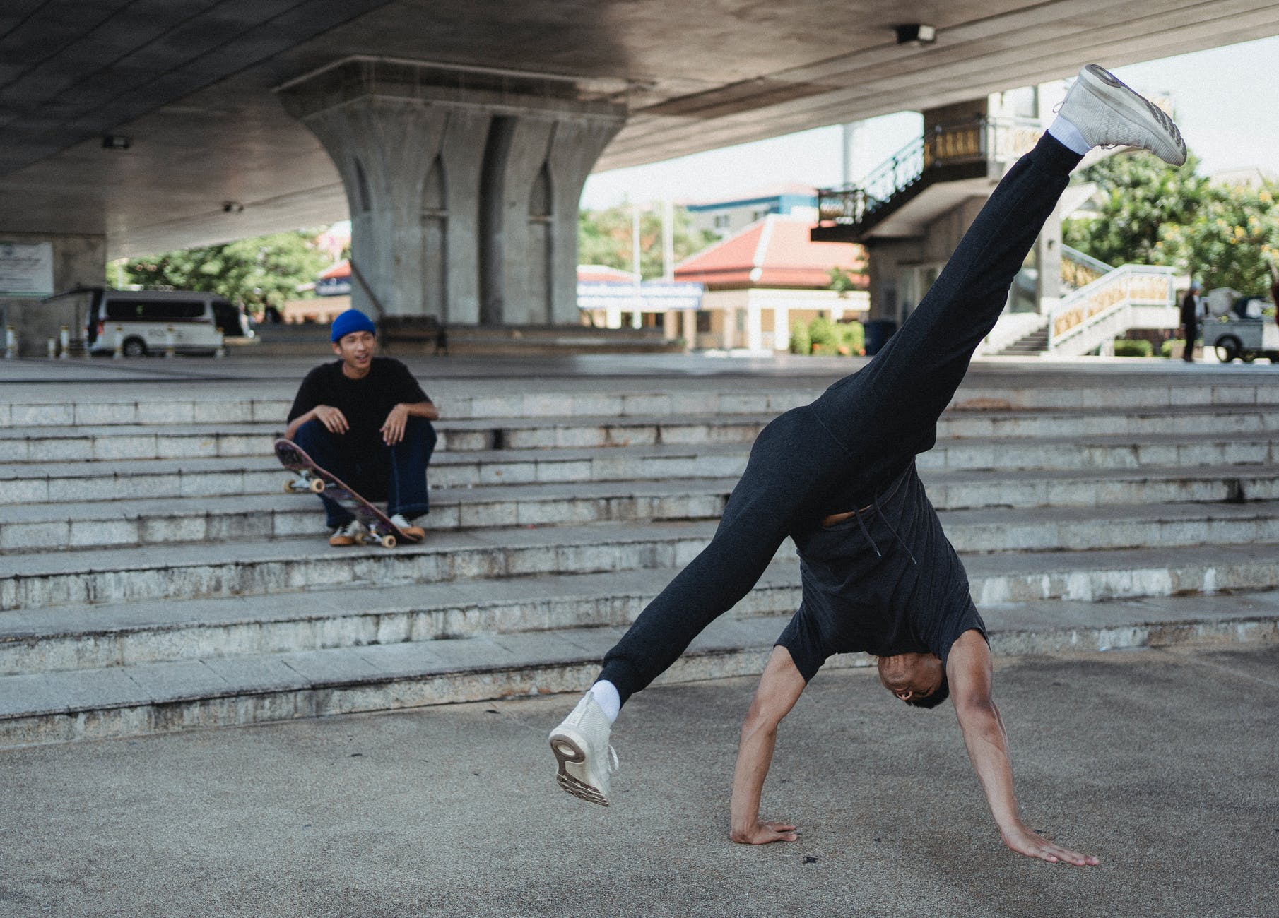 sporty male dancer doing handstand dance movement
