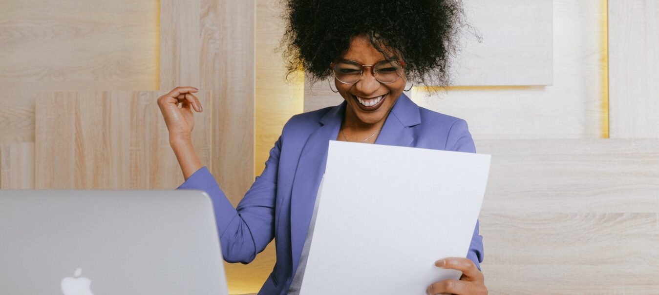 woman holding a paper