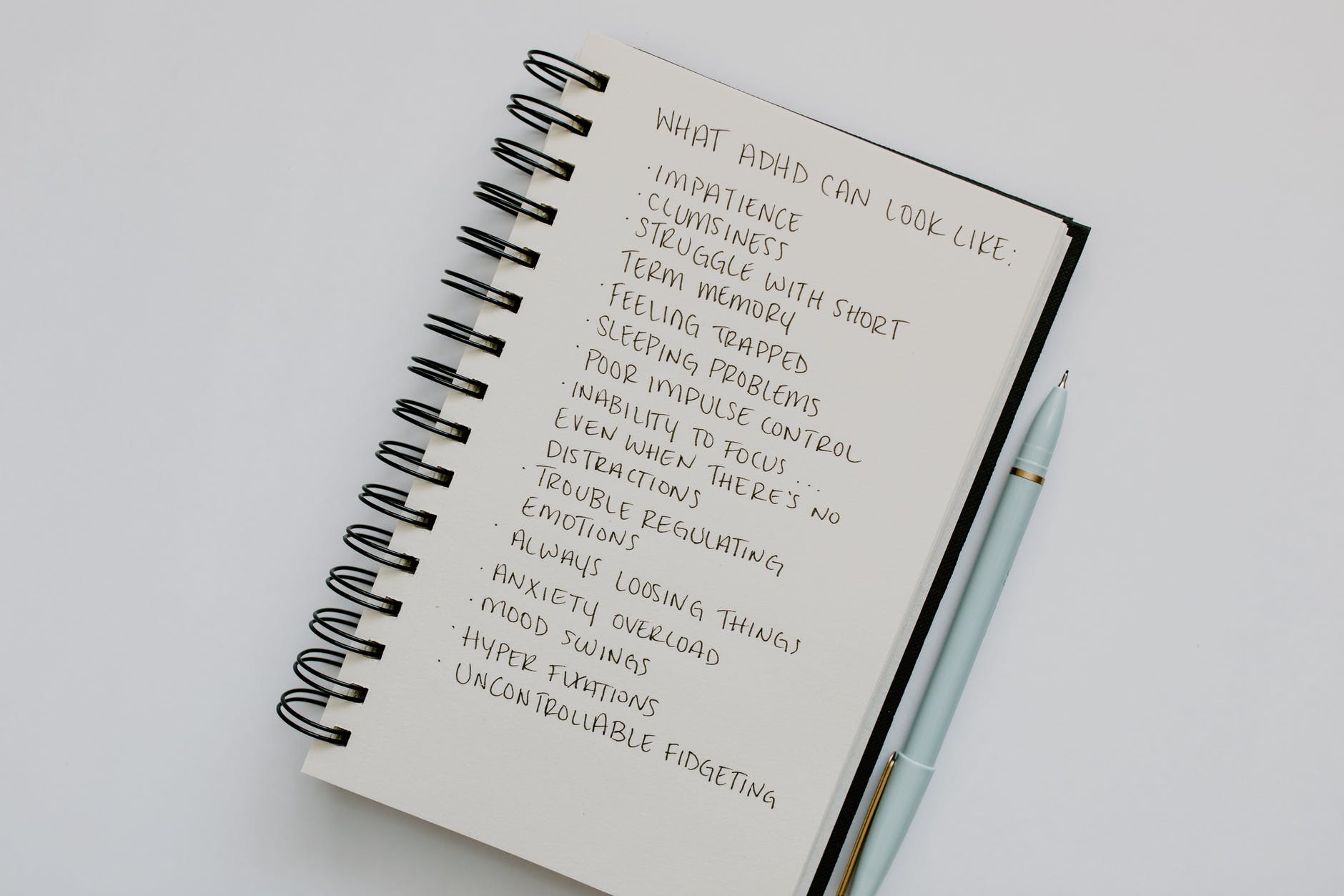 a list of disorder signs written on a notebook